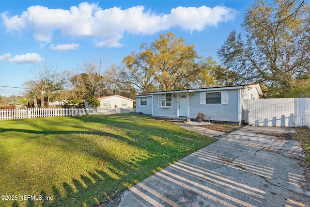 view of front of home with fence private yard and a front yard