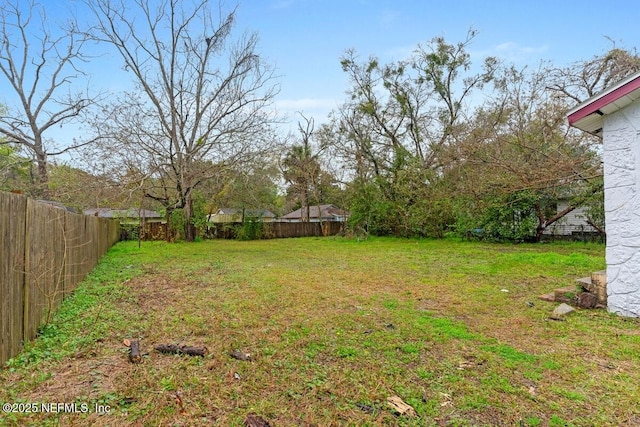 view of yard with a fenced backyard