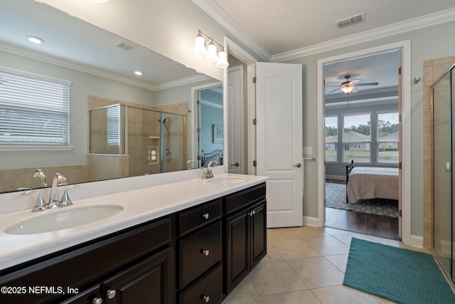 bathroom featuring visible vents, ornamental molding, ensuite bath, and a sink