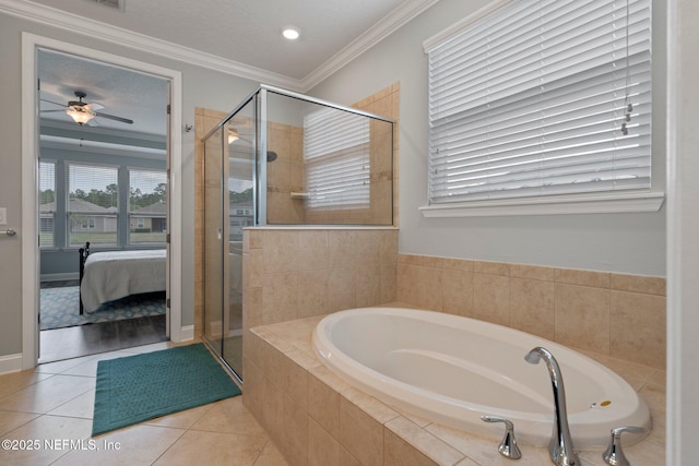 bathroom with a garden tub, ensuite bathroom, a shower stall, tile patterned flooring, and crown molding