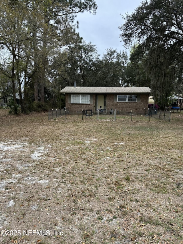 view of front of home featuring fence