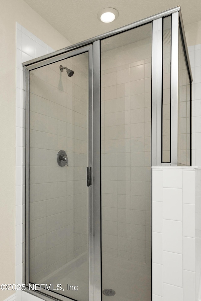 bathroom with a stall shower