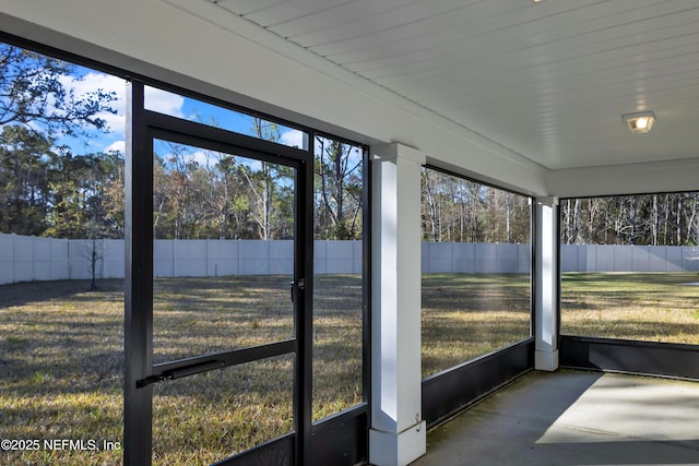 unfurnished sunroom featuring plenty of natural light