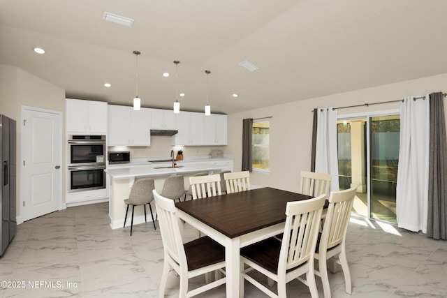 dining room with recessed lighting, visible vents, and marble finish floor