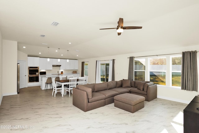 living room featuring vaulted ceiling, recessed lighting, visible vents, and marble finish floor