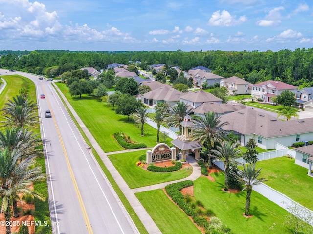 bird's eye view with a residential view and a view of trees