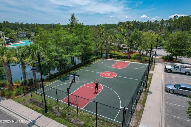 view of basketball court featuring community basketball court and fence