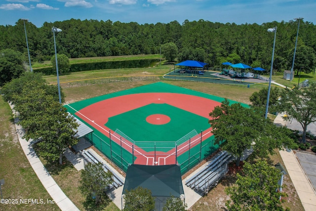 drone / aerial view featuring a wooded view