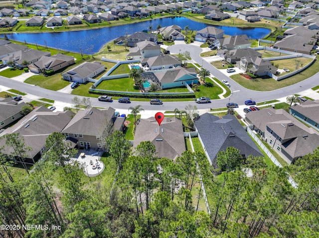 birds eye view of property with a residential view and a water view