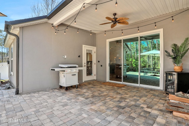 view of patio featuring wine cooler and ceiling fan