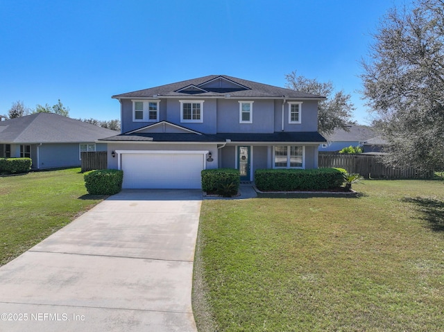 traditional home with fence, concrete driveway, a front yard, stucco siding, and a garage