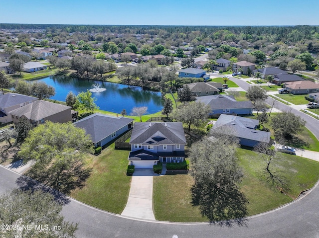 birds eye view of property featuring a residential view and a water view