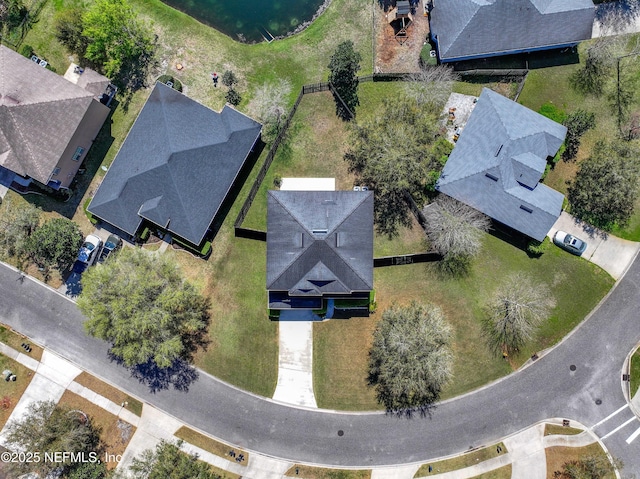 birds eye view of property with a residential view