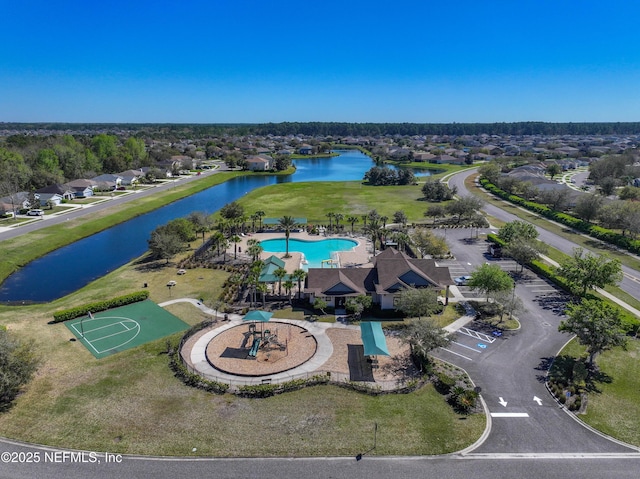 birds eye view of property with a water view