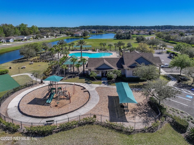 birds eye view of property with a water view