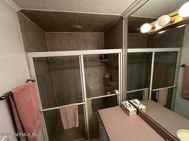 bathroom with a shower stall