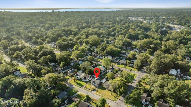 aerial view featuring a residential view, a view of trees, and a water view