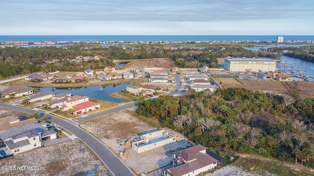 aerial view featuring a residential view and a water view