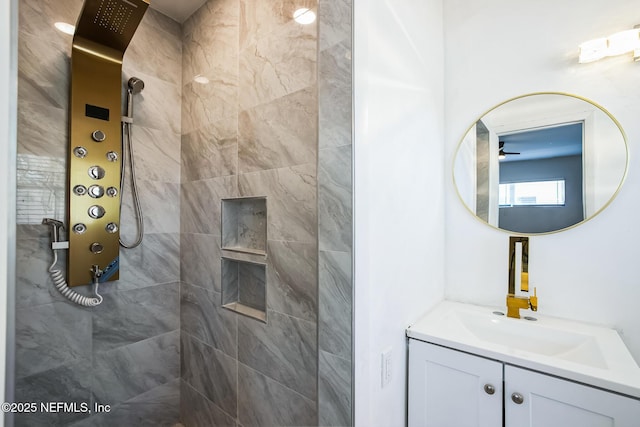 bathroom featuring vanity and a tile shower