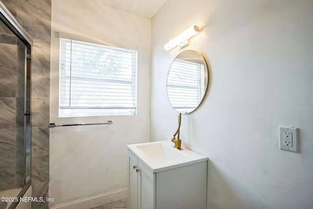 full bathroom with vanity and a shower with shower door