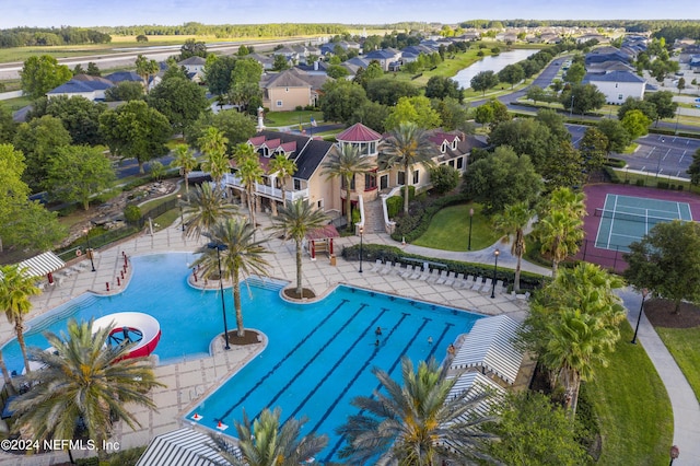 pool featuring a patio area and a residential view