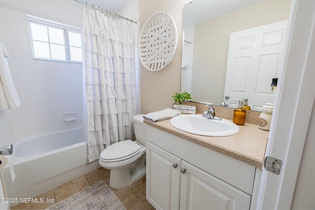 bathroom featuring tile patterned floors, shower / bath combination with curtain, toilet, and vanity