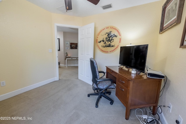 office area with visible vents, ceiling fan, baseboards, and carpet