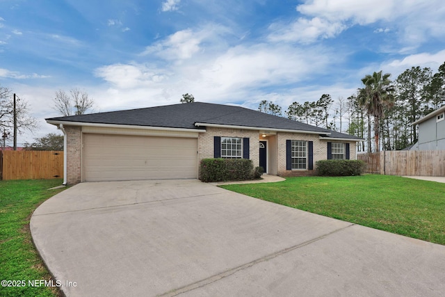 ranch-style home featuring a front yard, fence, a garage, and driveway