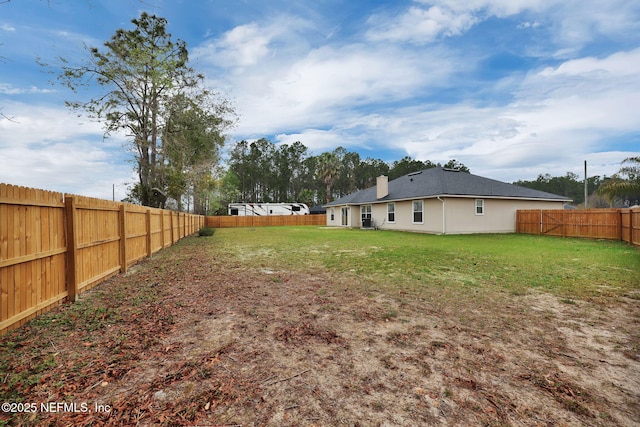 view of yard featuring a fenced backyard