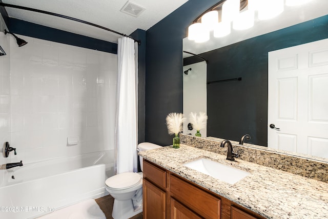 full bathroom featuring visible vents, toilet, vanity, shower / bath combo, and a textured ceiling