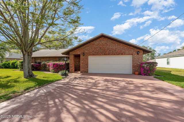 ranch-style house with brick siding, a garage, driveway, and a front lawn