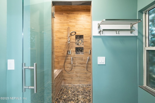 bathroom featuring a tile shower