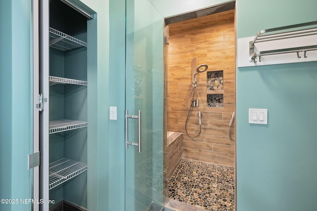 full bath with a shower stall