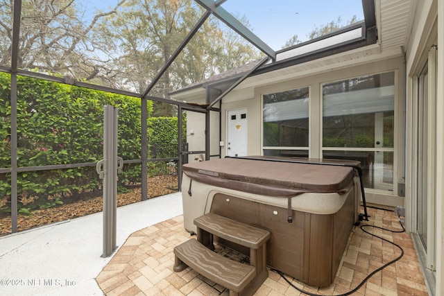 sunroom featuring a jacuzzi