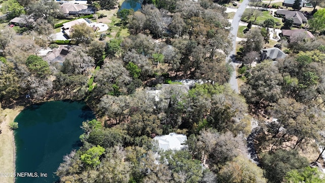 birds eye view of property featuring a residential view and a water view