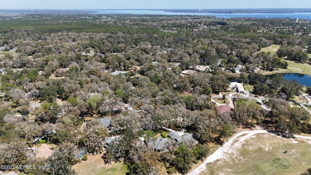 aerial view featuring a water view and a wooded view