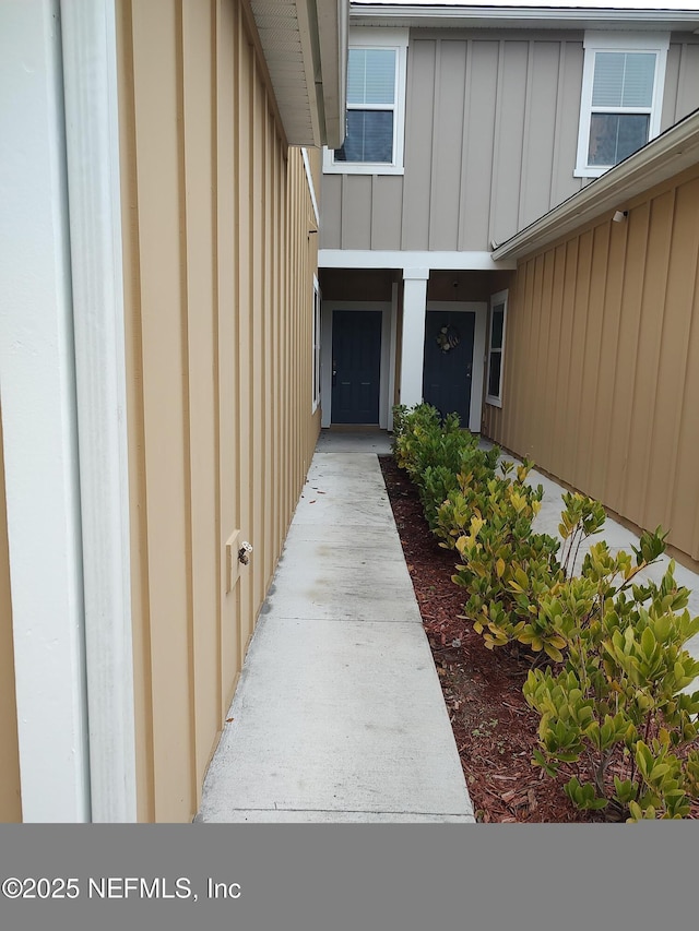 view of exterior entry with board and batten siding