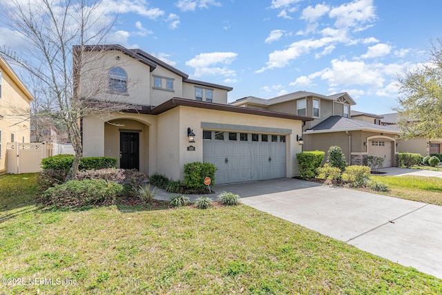 traditional-style home featuring fence, stucco siding, concrete driveway, a front lawn, and a garage