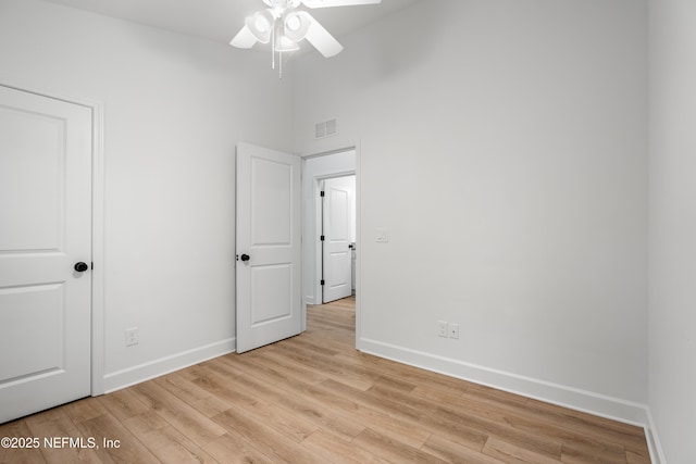 unfurnished bedroom featuring visible vents, light wood-type flooring, and baseboards