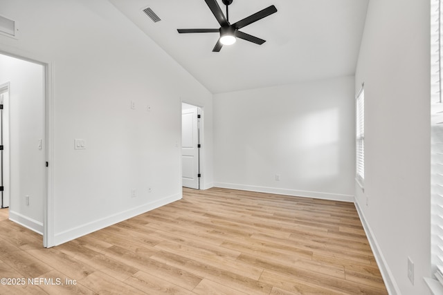 unfurnished room featuring visible vents, baseboards, ceiling fan, light wood-style flooring, and high vaulted ceiling