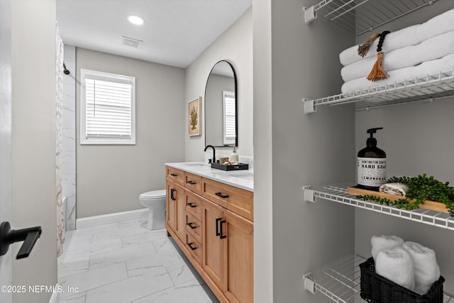 full bath featuring visible vents, baseboards, toilet, marble finish floor, and vanity