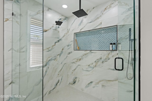 bathroom with a marble finish shower