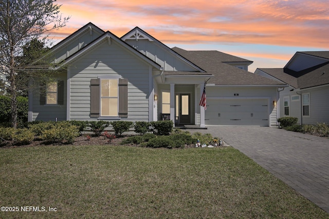 83 Village Grande Dr, Ponte Vedra, FL 32081 - view of front of house featuring driveway, a front lawn, a garage, and board and batten siding