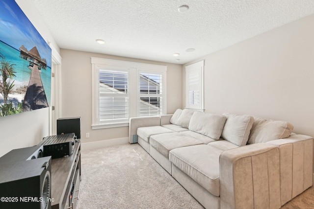 83 Village Grande Dr, Ponte Vedra, FL 32081 - carpeted living area with baseboards and a textured ceiling