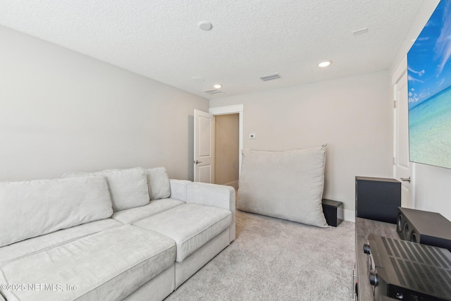 83 Village Grande Dr, Ponte Vedra, FL 32081 - living room with visible vents, baseboards, carpet flooring, recessed lighting, and a textured ceiling