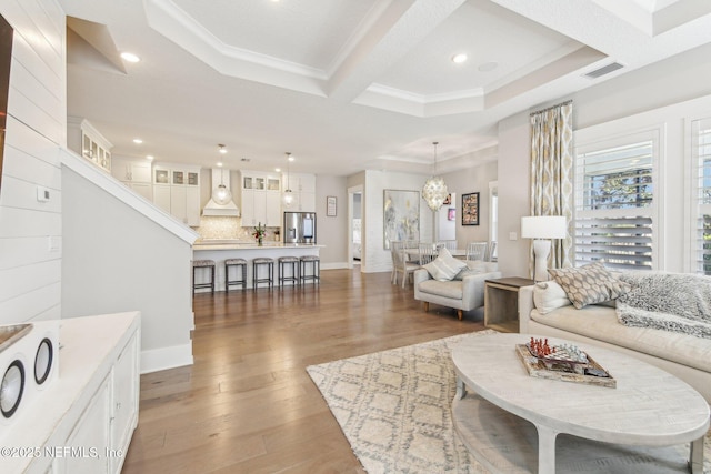 83 Village Grande Dr, Ponte Vedra, FL 32081 - living room with baseboards, visible vents, recessed lighting, ornamental molding, and light wood-style floors