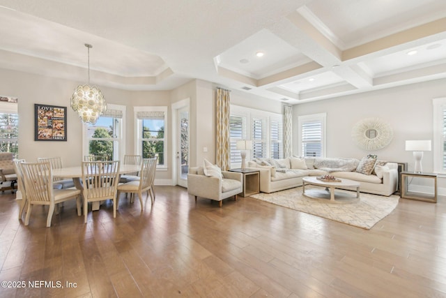 83 Village Grande Dr, Ponte Vedra, FL 32081 - living room featuring a wealth of natural light, wood-type flooring, coffered ceiling, and a chandelier