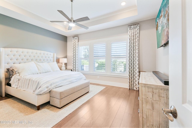 83 Village Grande Dr, Ponte Vedra, FL 32081 - bedroom with baseboards, a tray ceiling, hardwood / wood-style floors, recessed lighting, and a ceiling fan