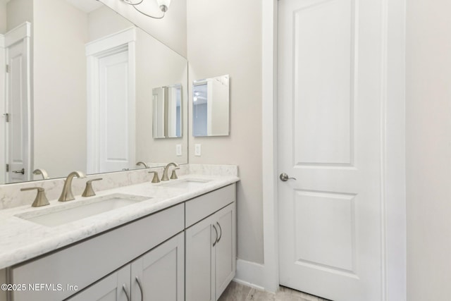83 Village Grande Dr, Ponte Vedra, FL 32081 - bathroom featuring double vanity, baseboards, and a sink
