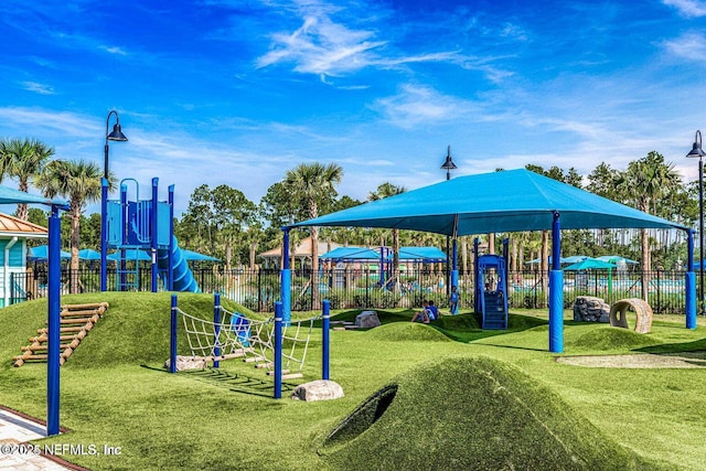 83 Village Grande Dr, Ponte Vedra, FL 32081 - community jungle gym with a lawn and fence